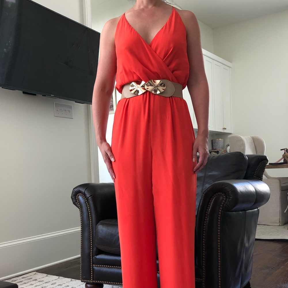 Gianni Bini coral jumpsuit and tan and gold belt